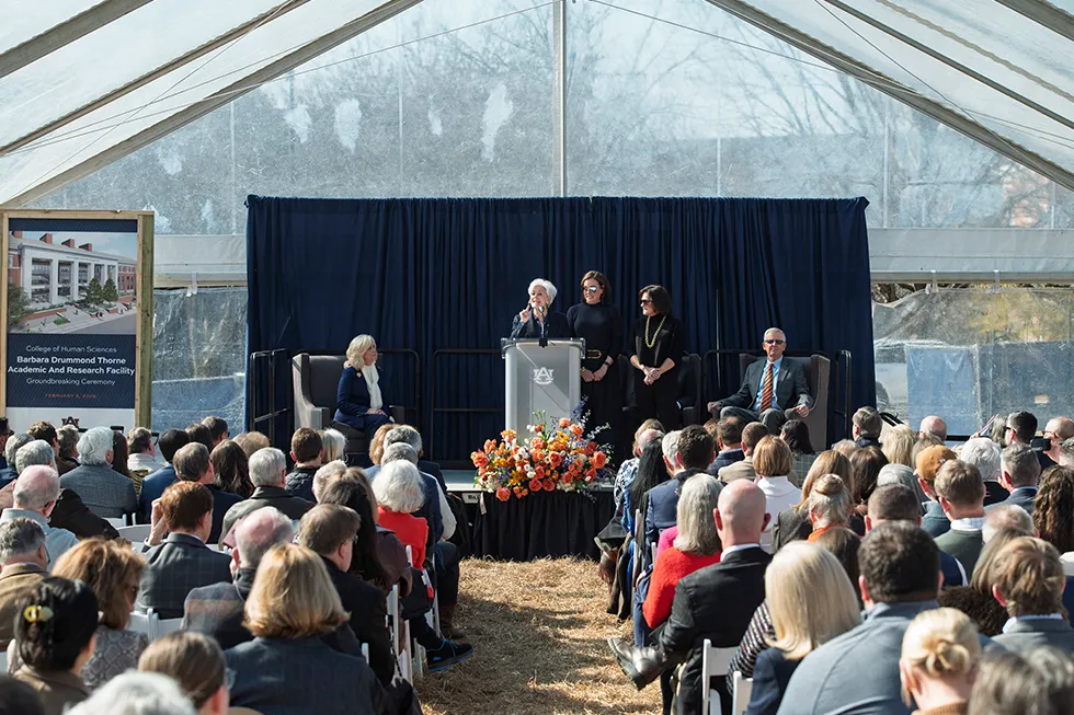 Auburn University representatives and guests pose with shovels at the Barbara Drummond Thorne Academic and Research Facility groundbreaking ceremony.